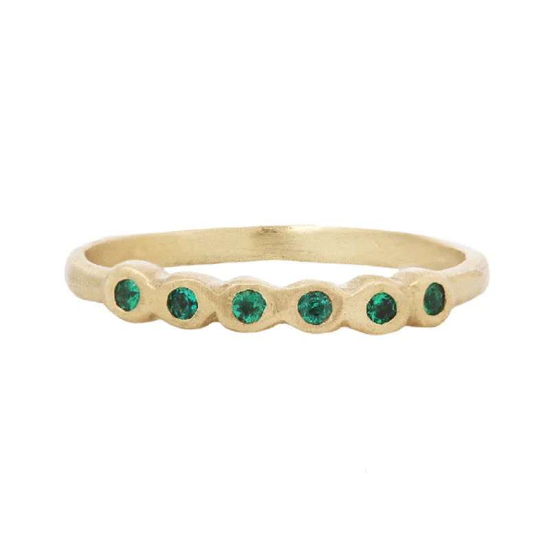 Upgrade Your Jewelry Collection For Less Half pebble band with emeralds