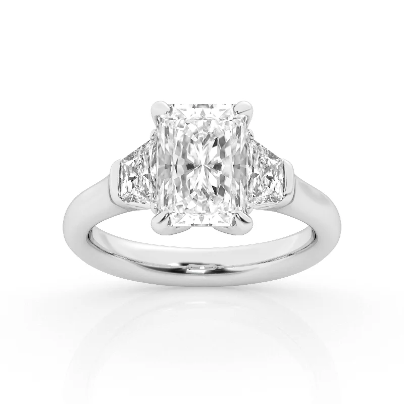 Chic And Stylish Jewelry At Exclusive Prices 3 Stone Ring with Center Radiant Lab Diamond with Trapezoids by Mercury Rings Chic And Stylish Jewelry At Exclusive Prices 3 Stone Ring with Center Radiant Lab Diamond with Trapezoids by Mercury Rings