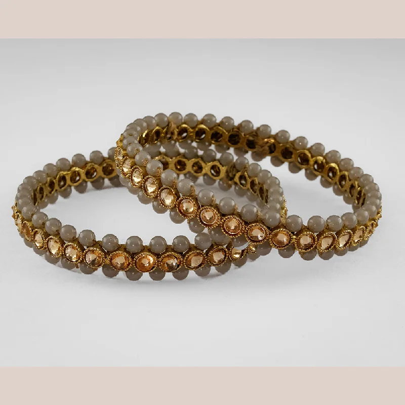 Shop Stylish Jewelry Now And Save Big SOB Set of two Moti Bangles with Studded Kundan & Handcrafted Bangles Shop Stylish Jewelry Now And Save Big SOB Set of two Moti Bangles with Studded Kundan & Handcrafted Bangles